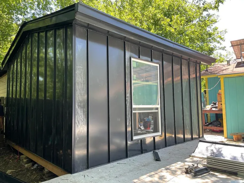 Black standing seam metal wall panels for Metal Roof Installation in Logan